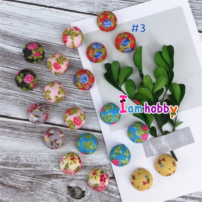 กระดุมปั๊มผ้าฐานเรียบลายดอกไม้ 15 มิล คละลาย ชุดที่ 3 (แพ็คละ 20 ชิ้น)