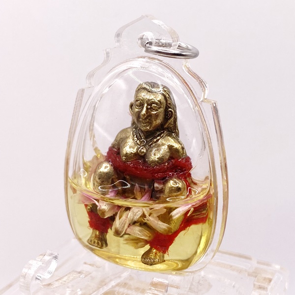 หลวงพ่อเมียน กัลยาโณ วัดจะเนียงวนาราม อีเป๋อดูดทรัพย์ มหาเสน่ห์ แช่น้ำมันว่านดอกทอง สีแดง KM009