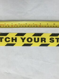 ANTI SLIP TAPE เทปกันลื่น สีเหลืองดำ หน้ากว้าง 2" ยาว 5 เมตร มีข้อความ " WATCH YOU STEP " เทปมีกาว ผิวหยาบ สำหรับติดบันได ทางเดิน